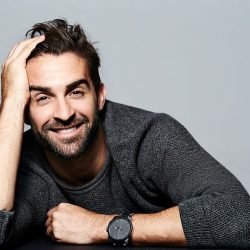 Smiling guy in grey sweater, portrait